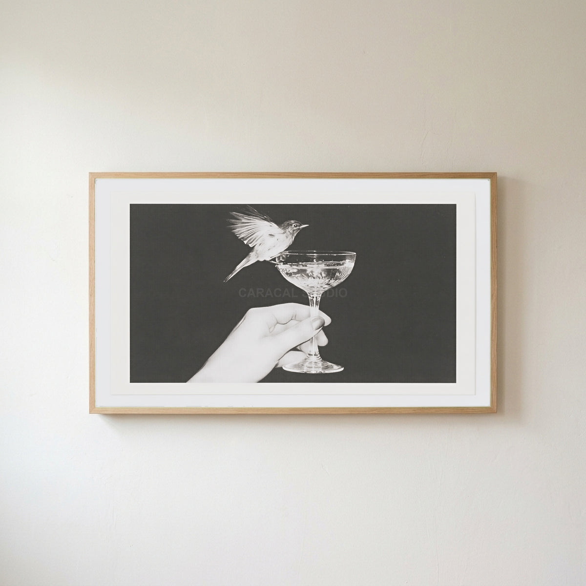 Bird and champagne glass Frame TV art in an oak frame on a warm white wall