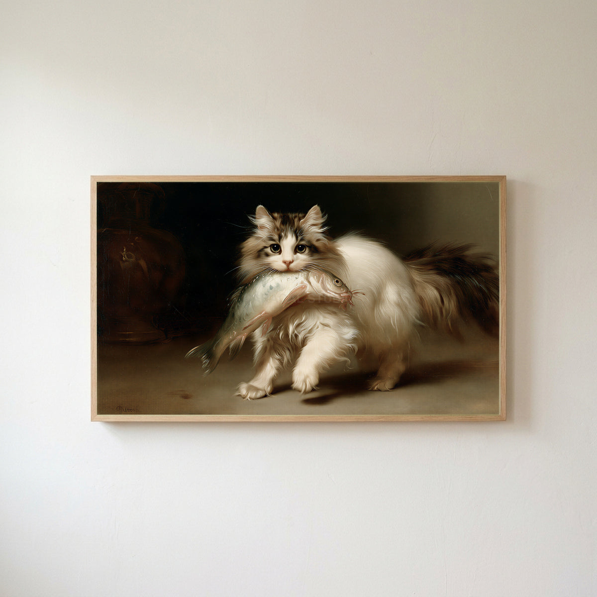 Kitten with a big fish Frame TV art in an oak frame on a warm white wall