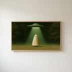 Ghost and UFO Frame TV art in an oak frame on a warm white wall