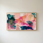 Tropical abstract Frame TV art in an oak frame on a warm white wall