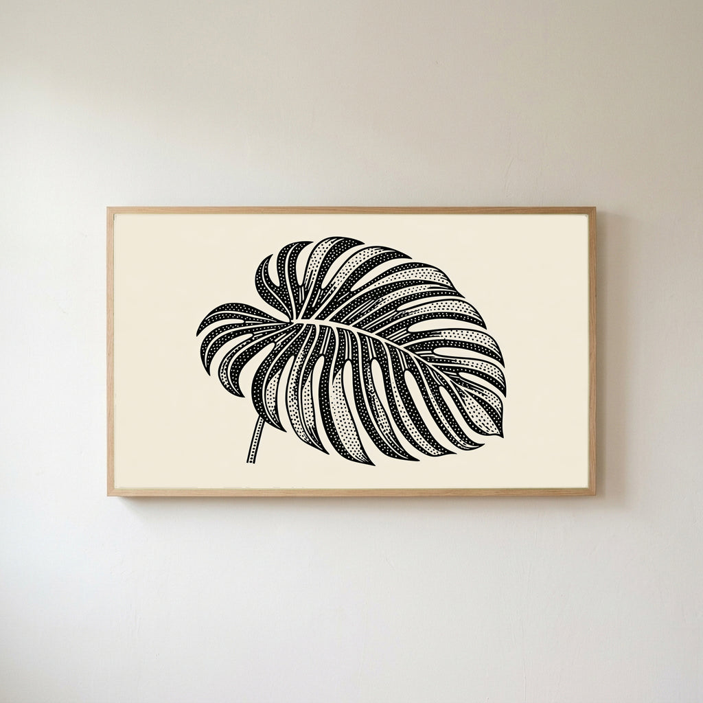Monstera leaf Frame TV art in an oak frame on a warm white wall