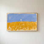 Cross on a golden field Frame TV art in an oak frame on a warm white wall