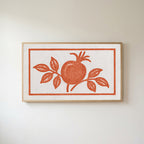 Pomegranate linocut Frame TV art in an oak frame on a warm white wall
