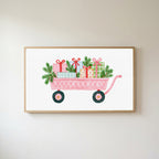 Pink wagon with gifts Frame TV art in an oak frame on a warm white wall