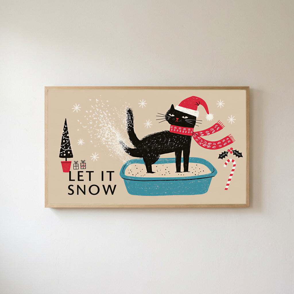 Let It Snow cat Frame TV art in an oak frame on a warm white wall