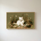 White kitten Frame TV art in an oak frame on a warm white wall