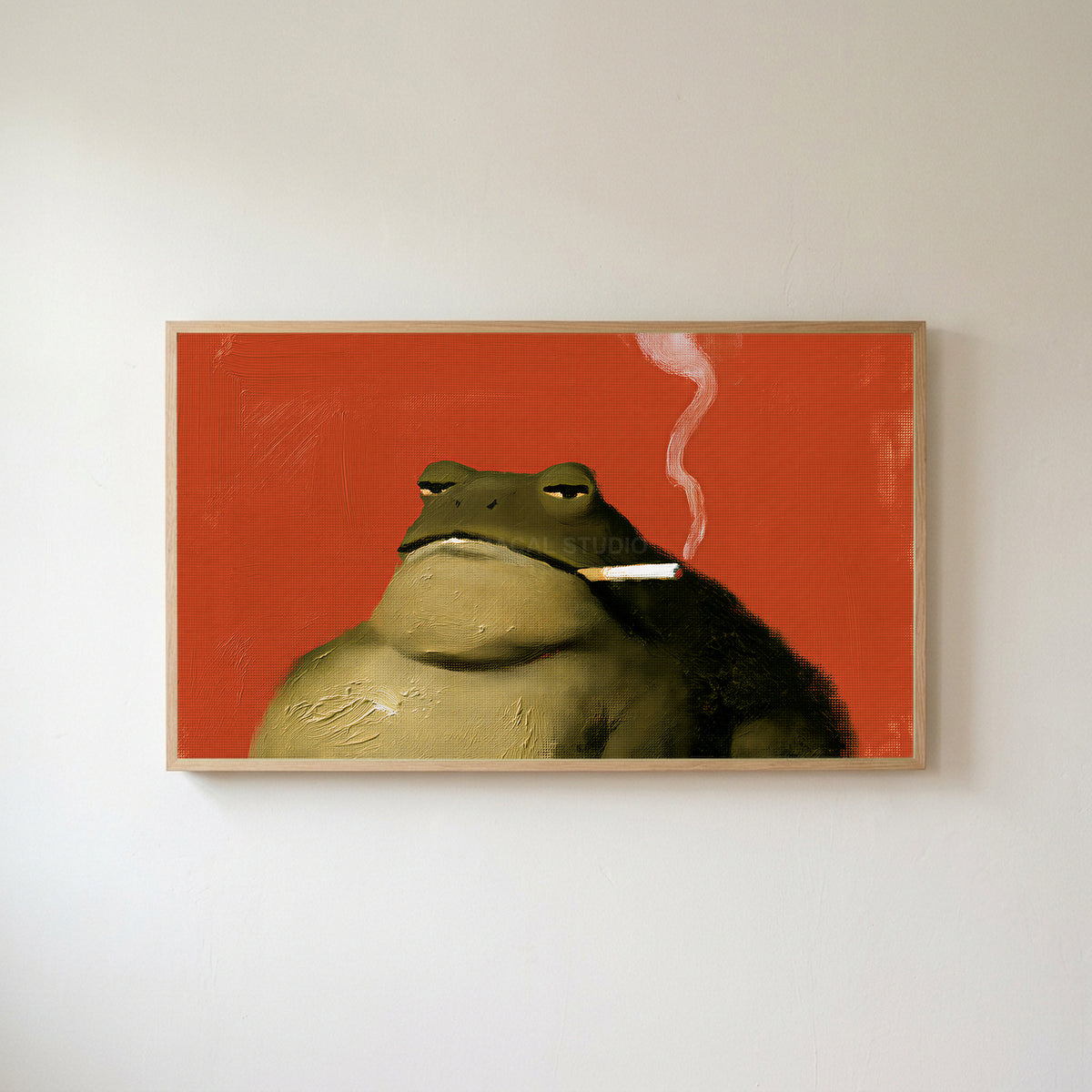 Smoking toad Frame TV art in an oak frame on a warm white wall