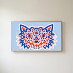 Three-eyed wolf Frame TV art in an oak frame on a warm white wall