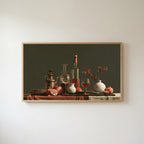 Wine and pomegranates still life Frame TV art in an oak frame on a warm white wall