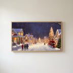 Snowy village with a red truck Frame TV art in an oak frame on a warm white wall