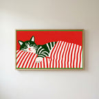 Sleeping cat and candy cane stripes Frame TV art in an oak frame on a warm white wall