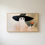 Ghost witch with a cocktail Frame TV art in an oak frame on a warm white wall