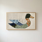 Patchwork duck Frame TV art in an oak frame on a warm white wall