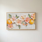 Blossom and orange Frame TV art in an oak frame on a warm white wall