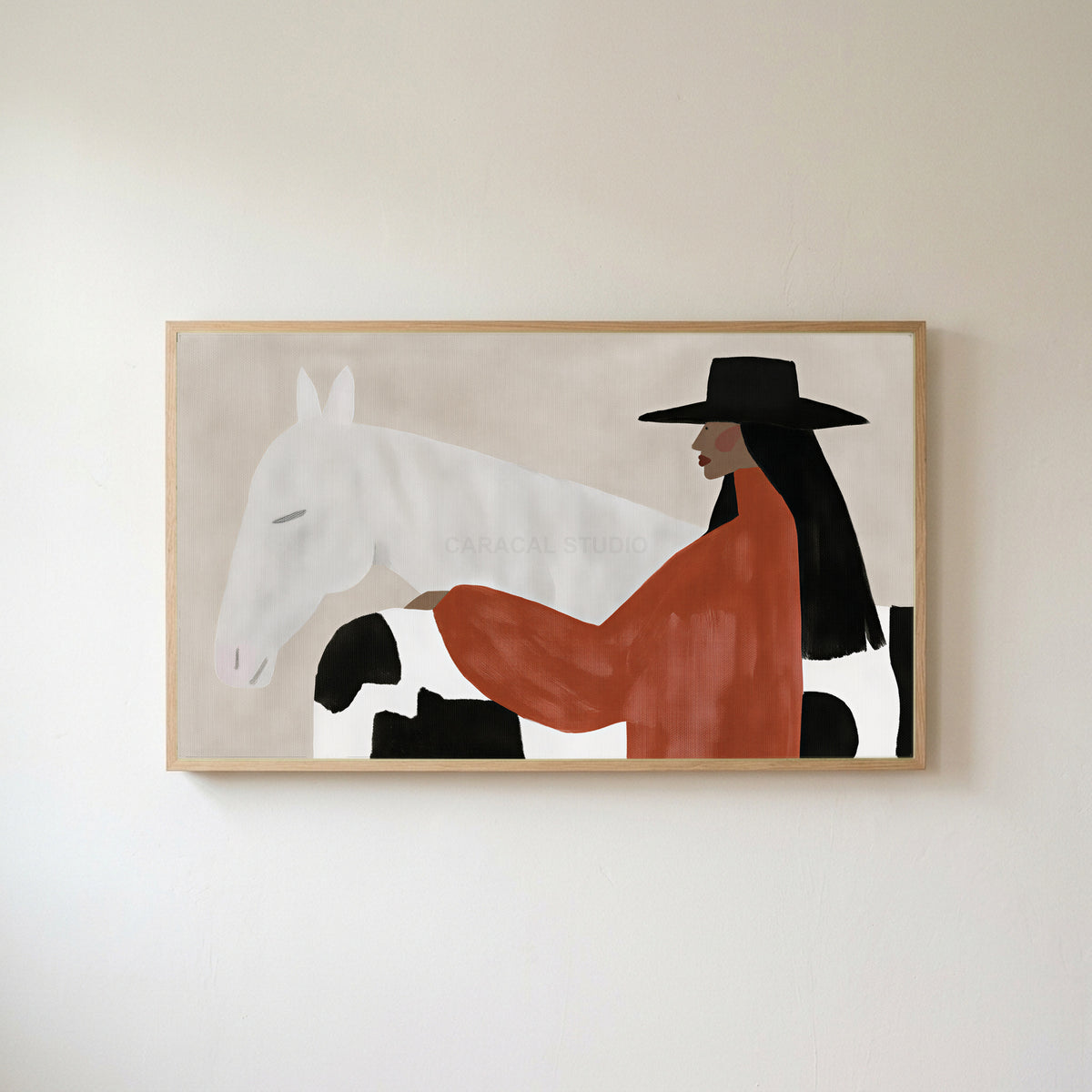 Cowgirl and her horse Frame TV art in an oak frame on a warm white wall