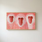 Snow monkeys with red dots Frame TV art in an oak frame on a warm white wall