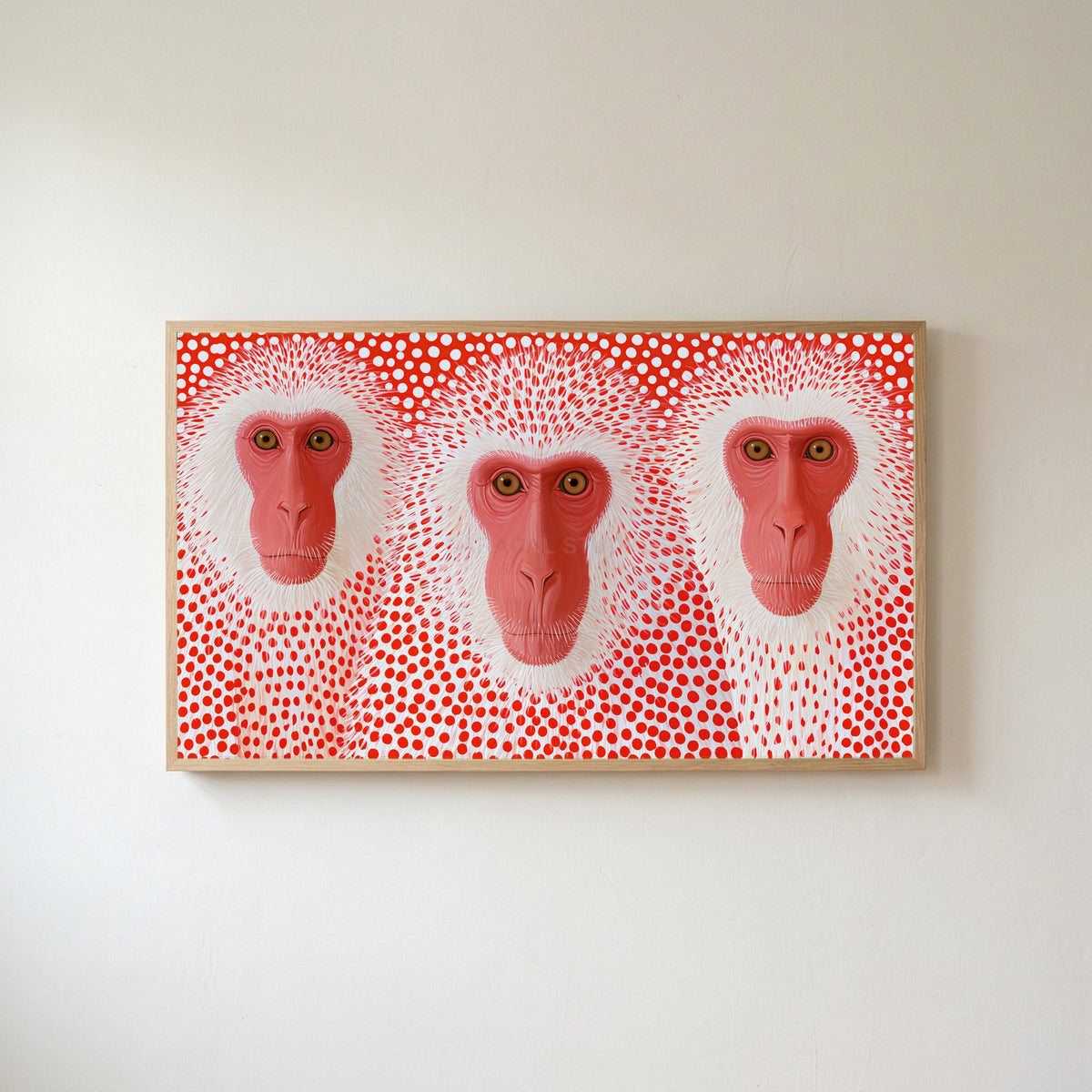 Snow monkeys with red dots Frame TV art in an oak frame on a warm white wall