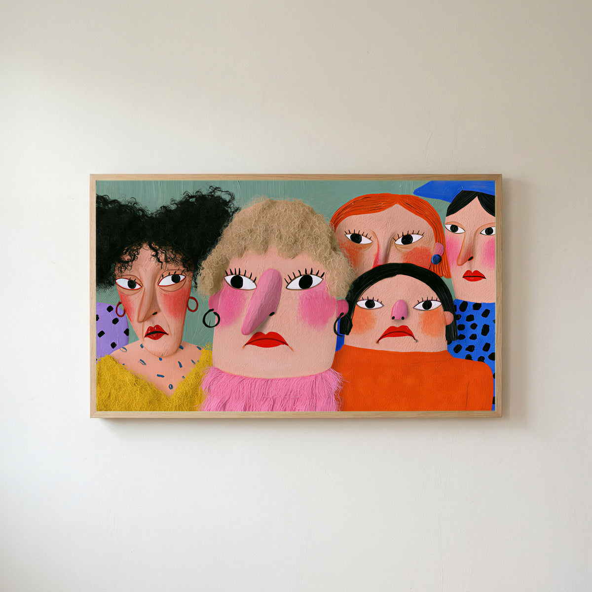 Funny faces portrait Frame TV art in an oak frame on a warm white wall