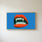 Vampire fangs Frame TV art in an oak frame on a warm white wall