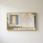 Blue shutter cottage window Frame TV art in an oak frame on a warm white wall