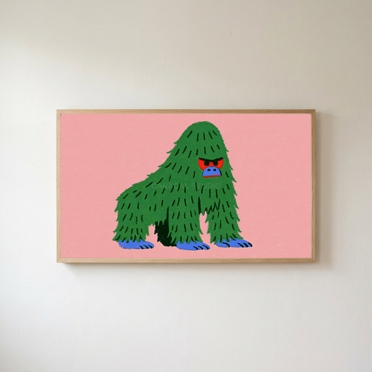 Grumpy gorilla Frame TV art in an oak frame on a warm white wall