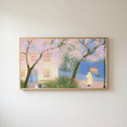 Cherry blossom street Frame TV art in an oak frame on a warm white wall