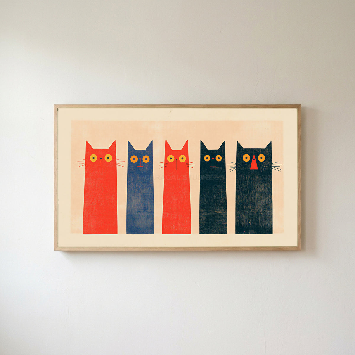 Five tall cats Frame TV art in an oak frame on a warm white wall