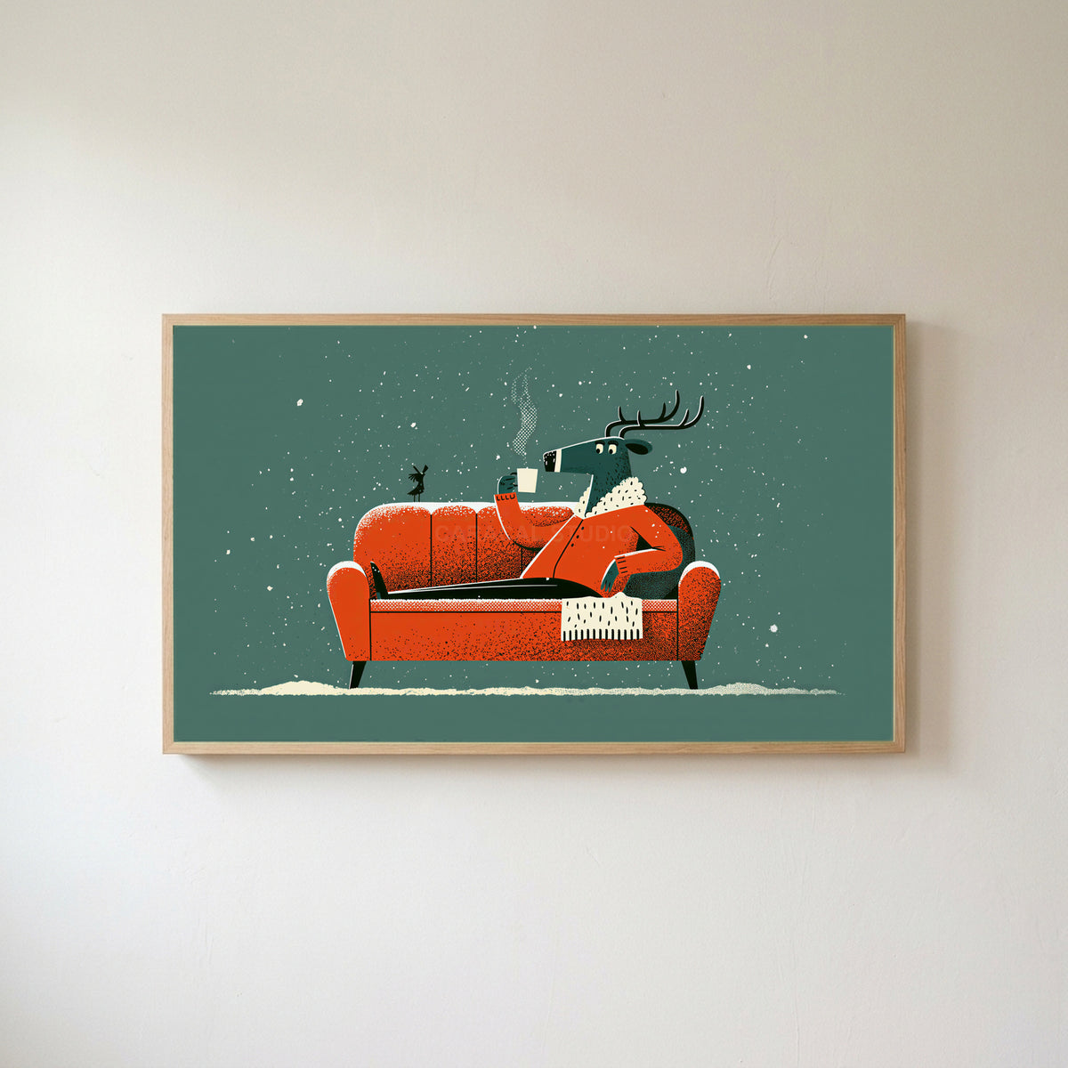 Reindeer on a sofa Frame TV art in an oak frame on a warm white wall