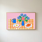 Breakfast table with flowers Frame TV art in an oak frame on a warm white wall