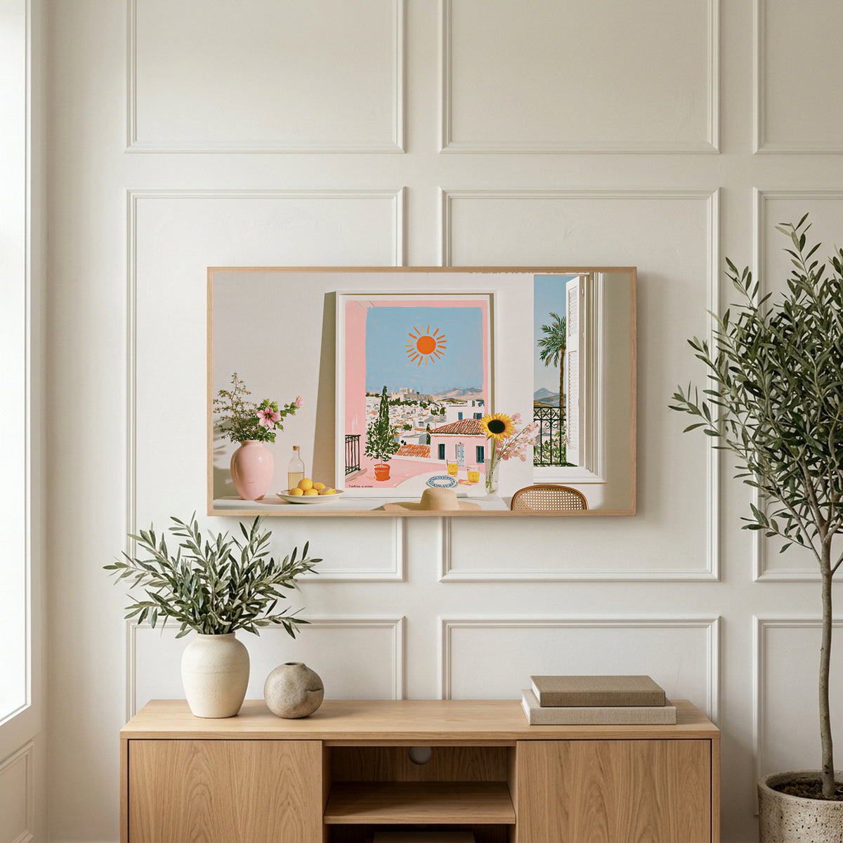 Athens summer still life art on a TV above a light oak sideboard with olive branches in a bright living room