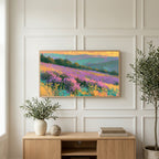 Heather hills art on a TV above a light oak sideboard with olive branches in a bright living room