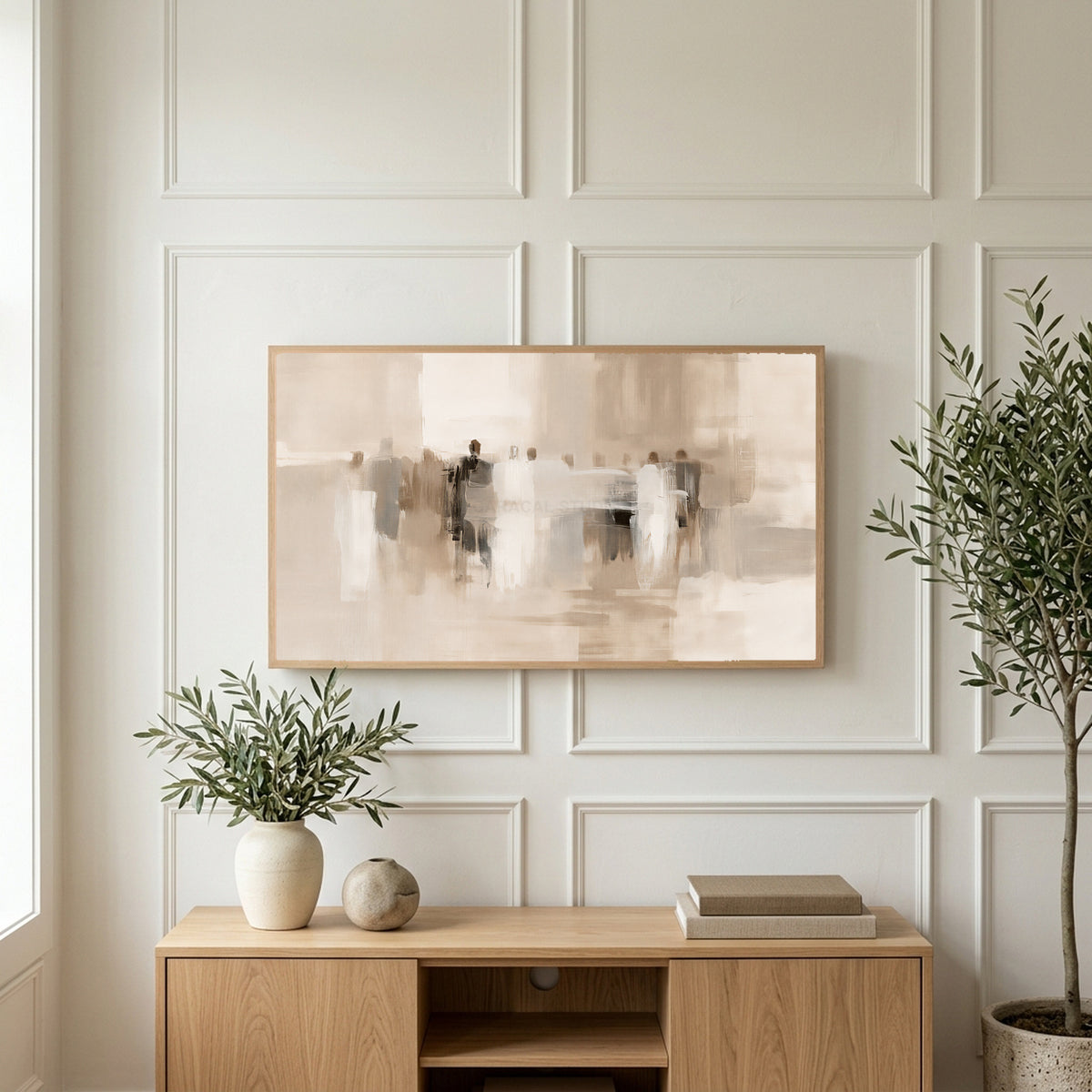 Neutral abstract figures art on a TV above a light oak sideboard with olive branches in a bright living room