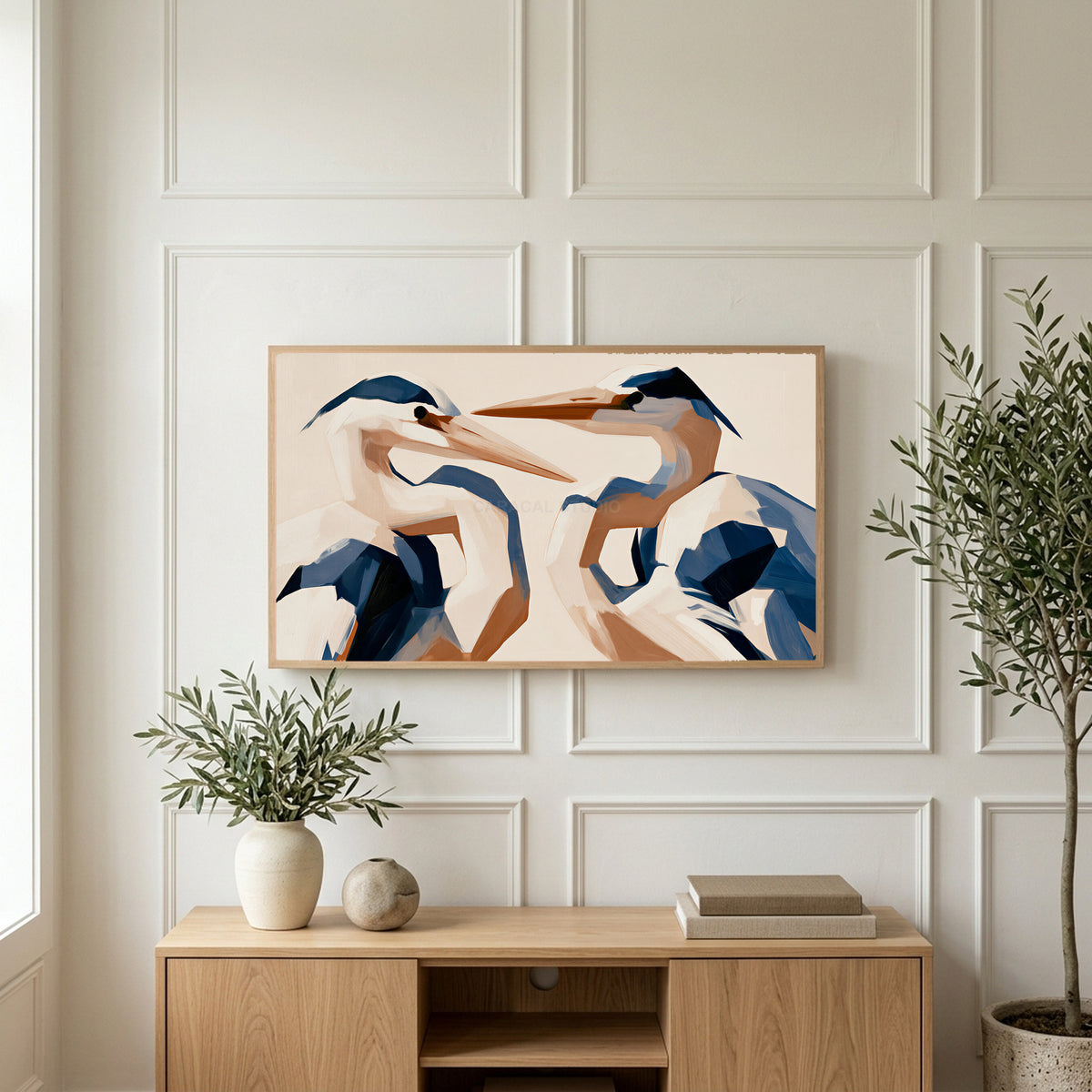 Blue heron art on a TV above a light oak sideboard with olive branches in a bright living room