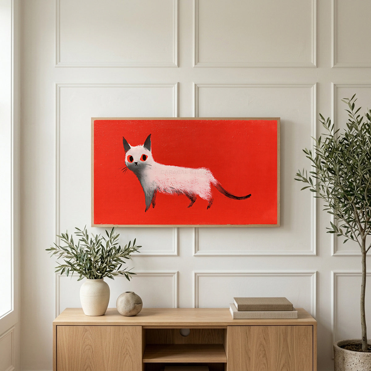 White cat art on a TV above a light oak sideboard with olive branches in a bright living room