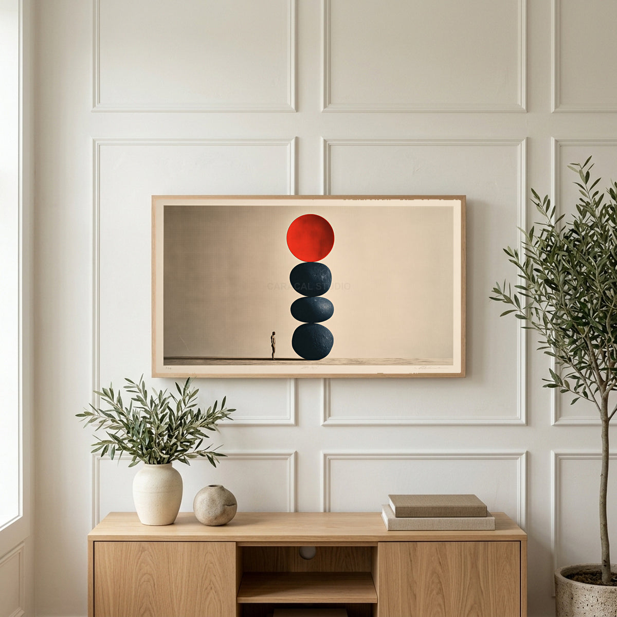 Stacked stones art on a TV above a light oak sideboard with olive branches in a bright living room