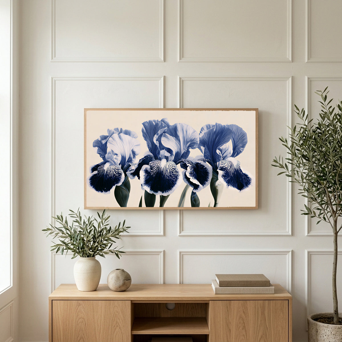 Blue iris art on a TV above a light oak sideboard with olive branches in a bright living room