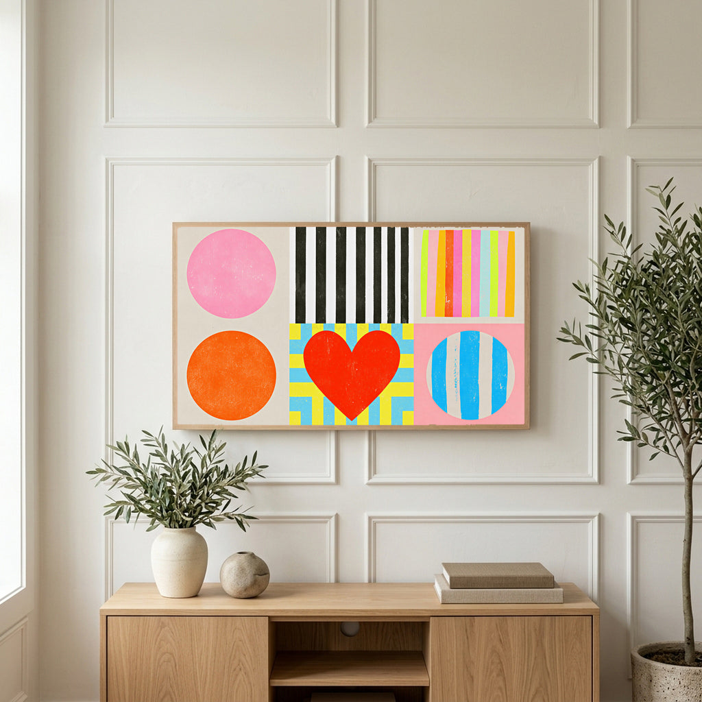 Colorful shapes and heart art on a TV above a light oak sideboard with olive branches in a bright living room