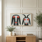 Folk art goats art on a TV above a light oak sideboard with olive branches in a bright living room