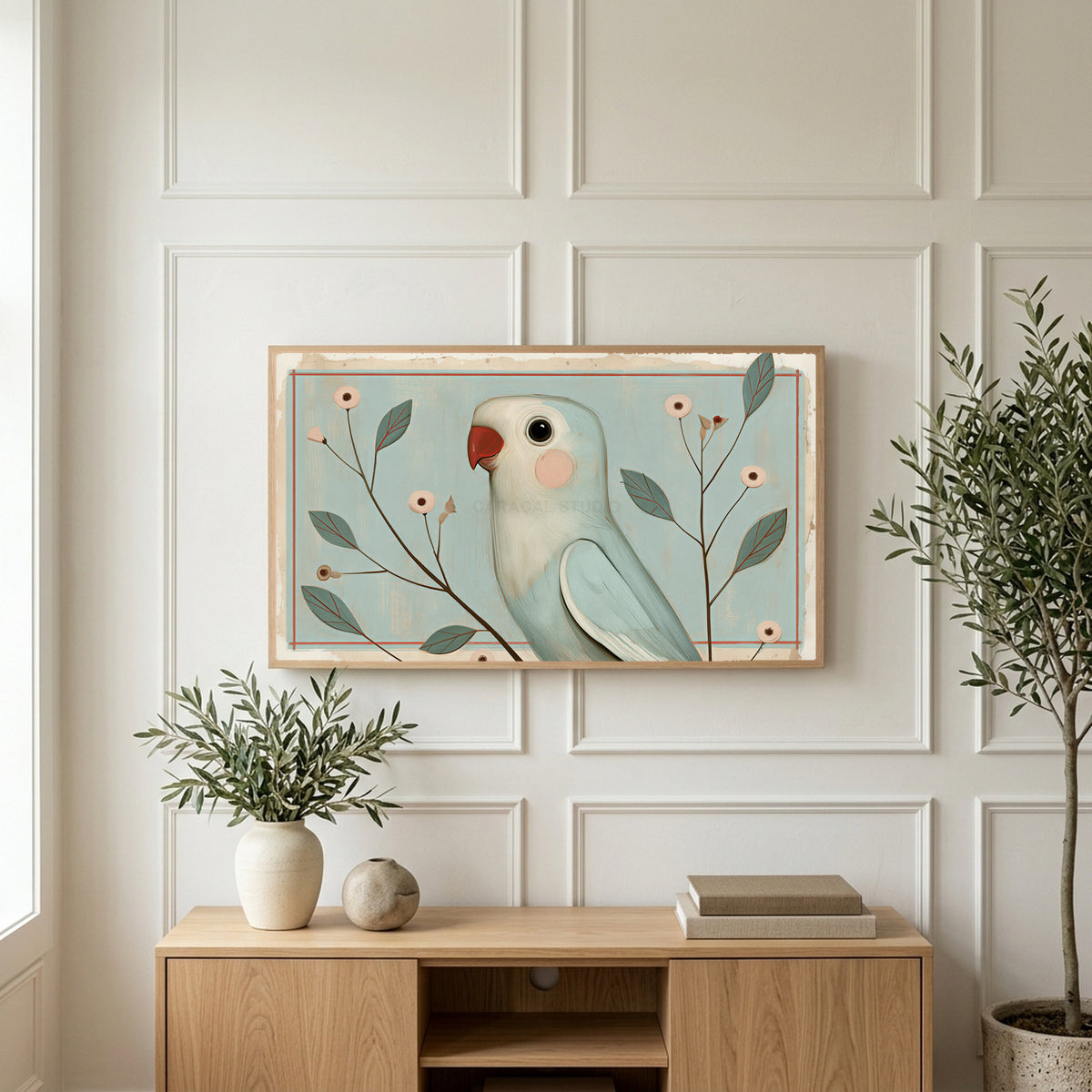 Vintage blue parrot art on a TV above a light oak sideboard with olive branches in a bright living room