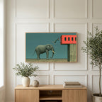 Elephant and leaping man art on a TV above a light oak sideboard with olive branches in a bright living room