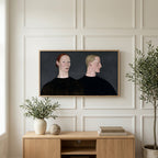 Two women portrait art on a TV above a light oak sideboard with olive branches in a bright living room