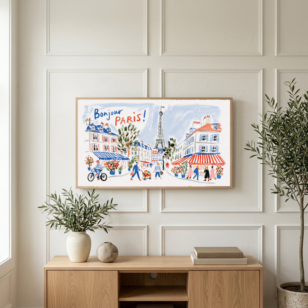 Bonjour Paris art on a TV above a light oak sideboard with olive branches in a bright living room