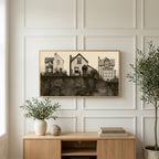 Three houses art on a TV above a light oak sideboard with olive branches in a bright living room