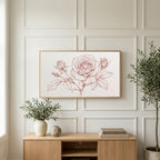 Rose line drawing art on a TV above a light oak sideboard with olive branches in a bright living room