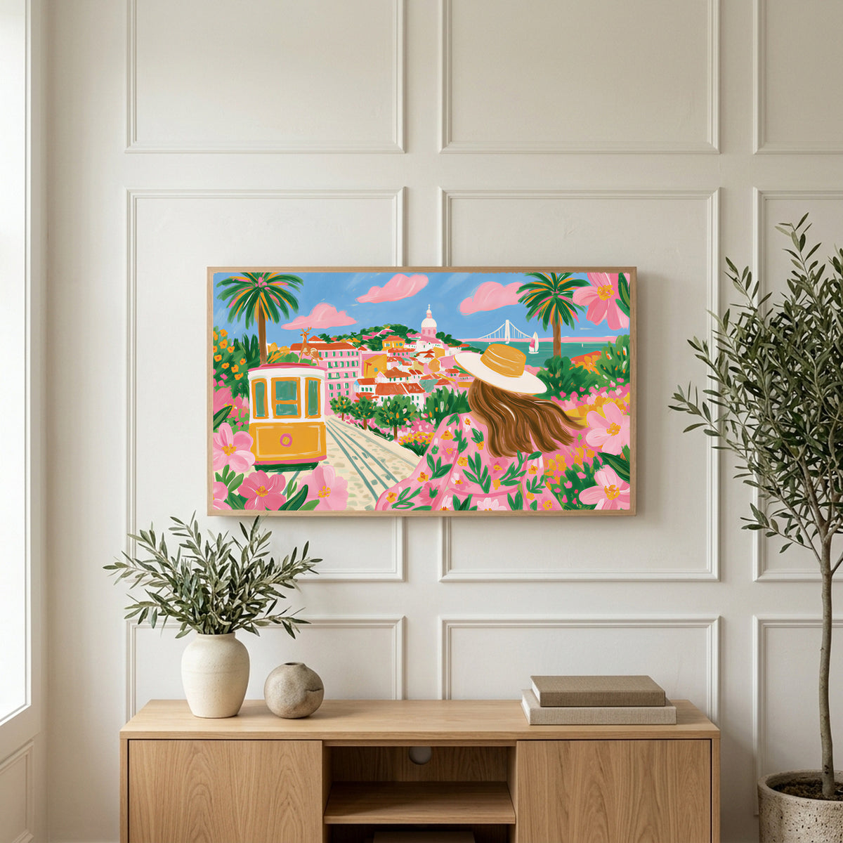 Lisbon tram art on a TV above a light oak sideboard with olive branches in a bright living room