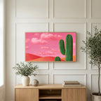 Saguaro cactus art on a TV above a light oak sideboard with olive branches in a bright living room