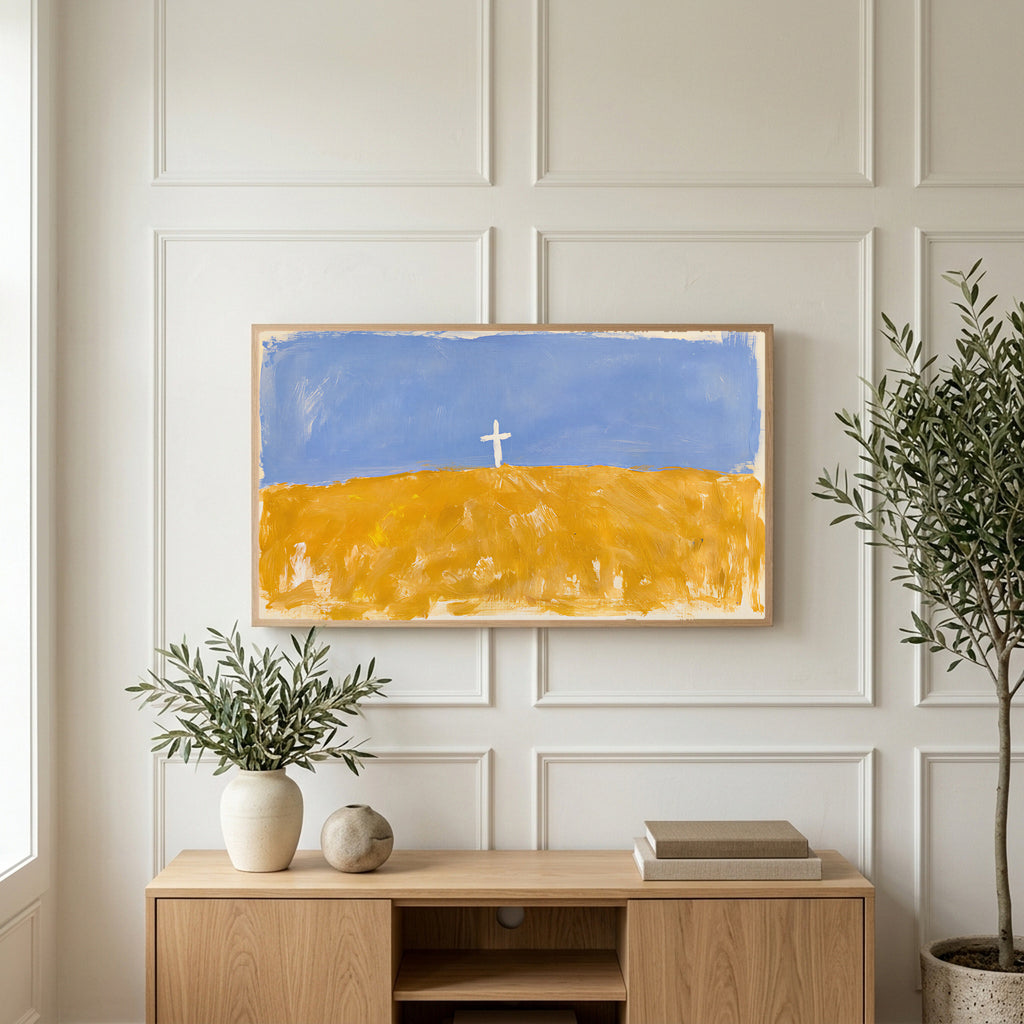 Cross on a golden field art on a TV above a light oak sideboard with olive branches in a bright living room