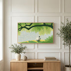 Lake and tree landscape art on a TV above a light oak sideboard with olive branches in a bright living room