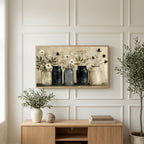 Farmhouse flower jars art on a TV above a light oak sideboard with olive branches in a bright living room