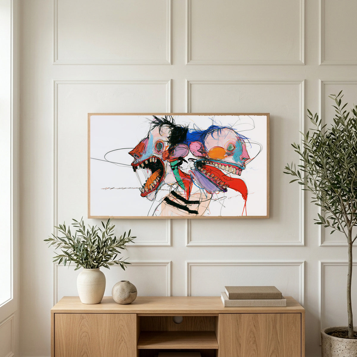 Expressive faces art on a TV above a light oak sideboard with olive branches in a bright living room